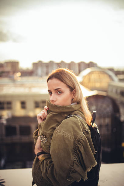 istock Beautiful young woman on the rooftop 1023683418
