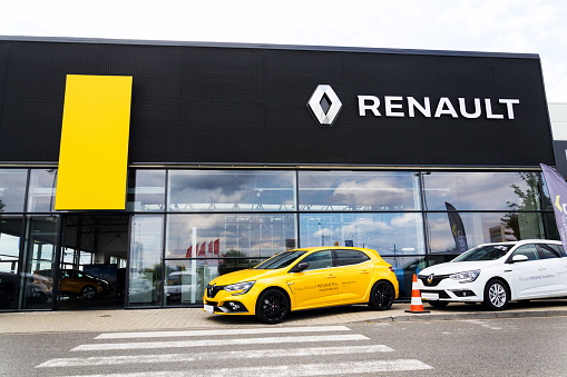 Prague, Czech Republic - August 15, 2018: Renault company logo on car in front of dealership building on August 15, 2018 in Prague, Czech Republic.