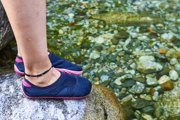 istock Girl foot on a river 1023692964