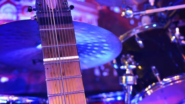 istock Guitar and musical instruments close-up, evening light 1023697380