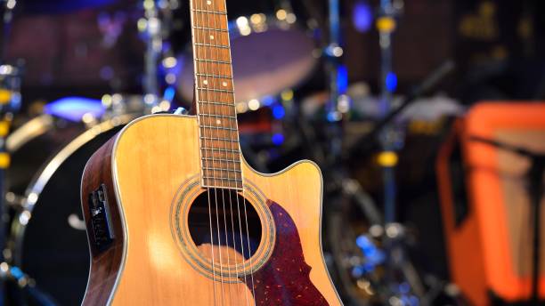 istock Guitar and musical instruments close-up, evening light 1023697384