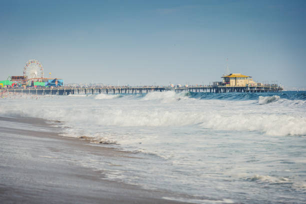 istock Santa Monica pier and ocean waves in overcast day 1023697674