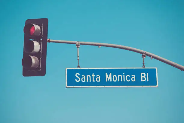 Santa Monica Blvd road sign with road lights in vintage tone
