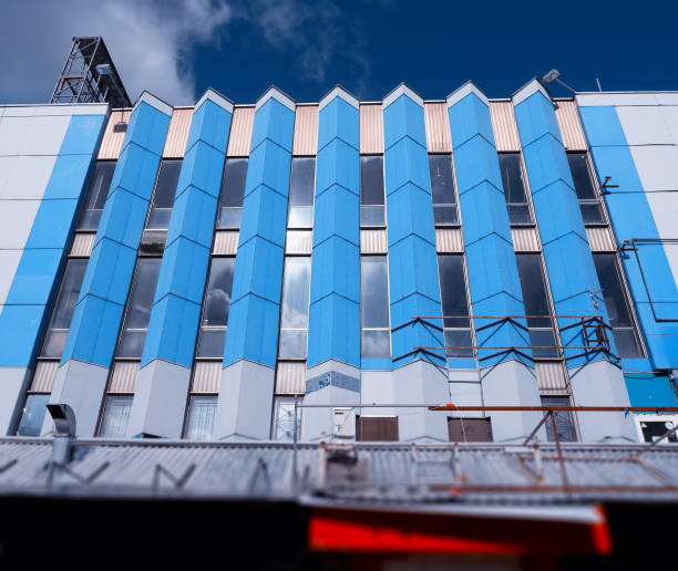 istock Building with vertical blue window columns city background 1023698478