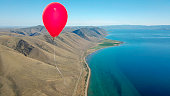 Red balloon over Bear Lake from directly above