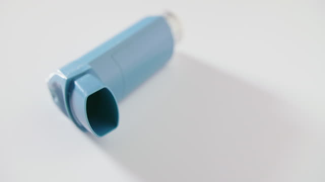Closeup Of Blue Inhaler On Table