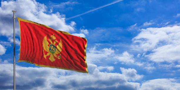 istock Montenegro waving flag on blue sky. 3d illustration 1023716052