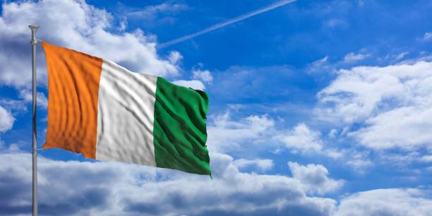 istock Ivory Coast waving flag on blue sky. 3d illustration 1023716274