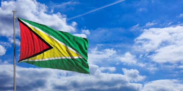 istock Guyana waving flag on blue sky. 3d illustration 1023716316