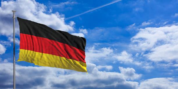 istock Germany waving flag on blue sky. 3d illustration 1023716338