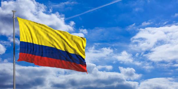 istock Colombia flag on a blue sky background. 3d illustration 1023716406