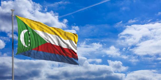 istock Comoros flag on a blue sky background. 3d illustration 1023716422