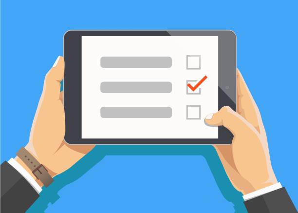 istock Online survey, checklist. Hand holds tablet and finger touch screen. Feedback business concept. Cartoon flat vector illustration isolated on blue. Minimalistic design for web site, mobile app 1023723046