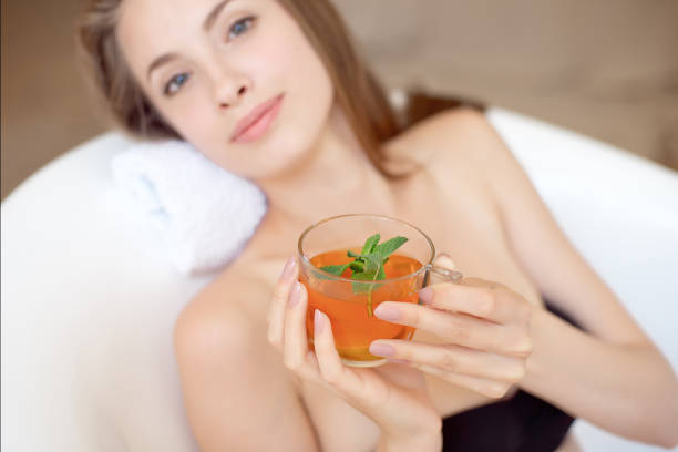 istock Caucasian smiling woman after spa covered with white towel 1023723320