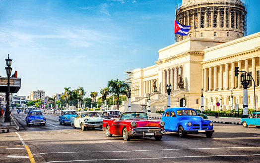 Vintage cars at rush hour in the morning in front of capitolio in La Habana. Cuba