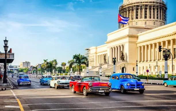Vintage cars at rush hour in the morning in front of capitolio in La Habana. Cuba