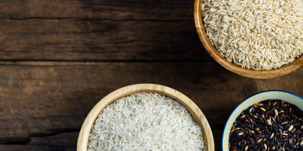 istock Different types of rice in wooden bowls such as basmati, brown a 1023723768