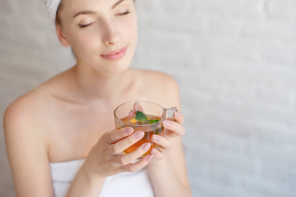 istock Caucasian smiling woman after spa covered with white towel 1023726556