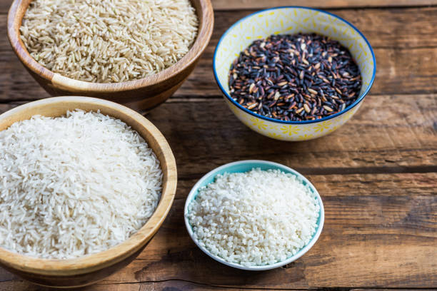 istock Different types of rice in wooden bowls such as basmati, brown a 1023726832