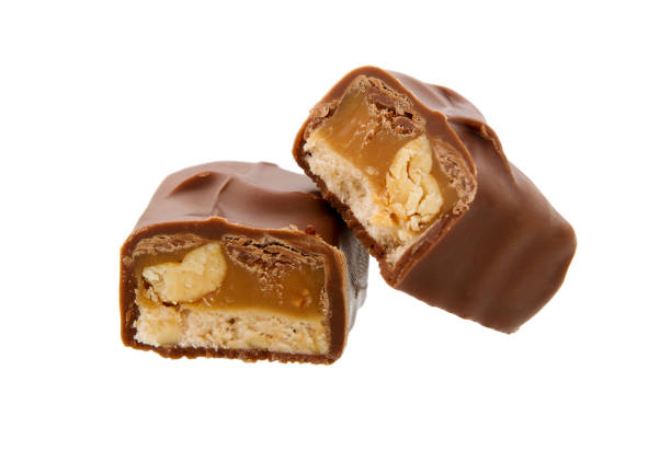 istock Chocolate candy with filling isolated on a white background. Cut chocolate candies 1023732536