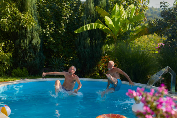 istock Senior Friends Pool Fun 1023735266