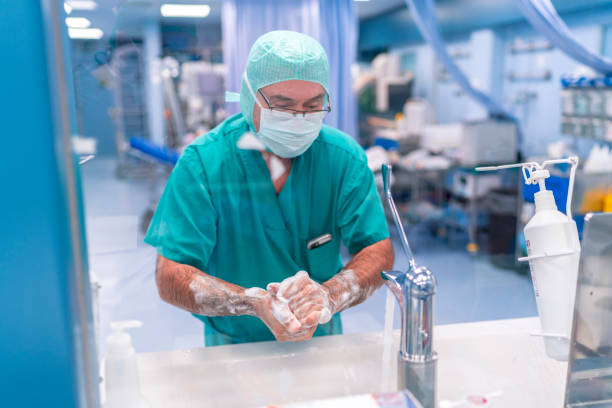 istock Portrait of a surgeon washing her hands 1023738350