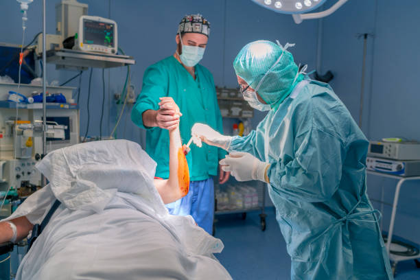 istock Surgery team preparing the patient for surgery 1023738616