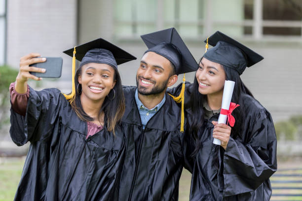 istock College friends smile for selfie 1023742060