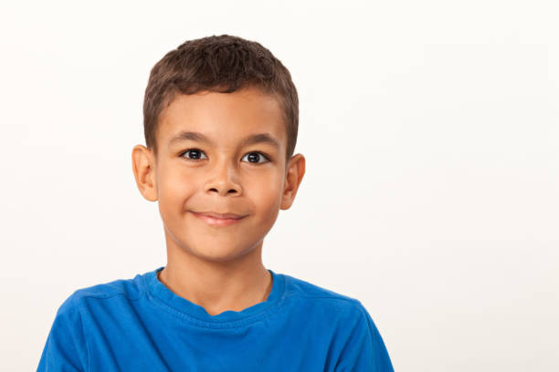 istock studio portrait of 10 year old schoolboy on white background 1023754414