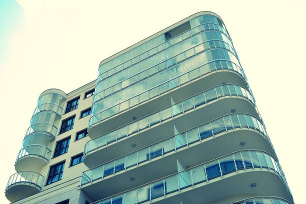 istock Modern apartment building exterior. Retro colors stylization 1023754750