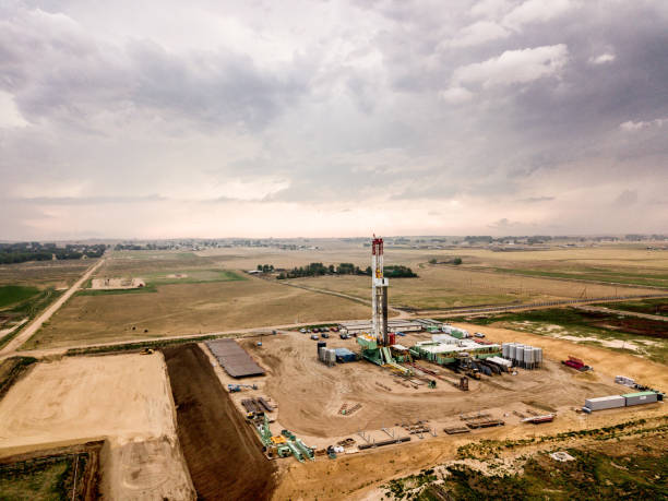 istock Fracking Drilling Rig in Front of a Dramatic Sky at Dusk 1023754782