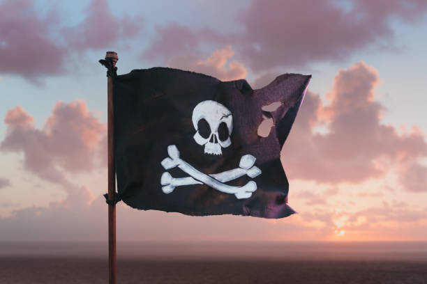 istock Pirate flag waving at sea 1023766670