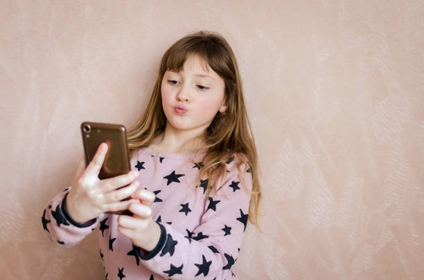 istock Little girl take a selfie 1023769634