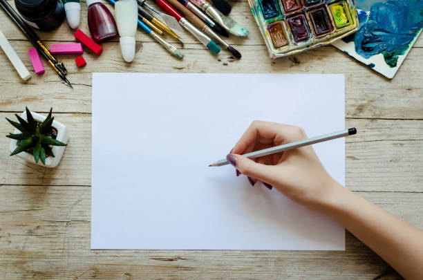 istock Creative artist workplace flat lay, mockup on wooden background 1023769640