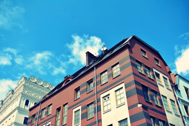 istock Modern apartment building exterior. Retro colors stylization 1023769948