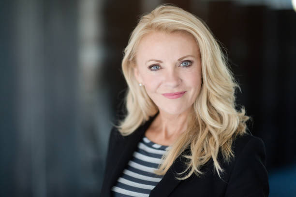 Portrait Of A Mature Businesswoman Smiling At The Camera stock photo