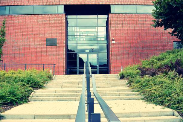istock Modern office building on a clear sky background. Retro stylized colorful tonal filter effect 1023773052