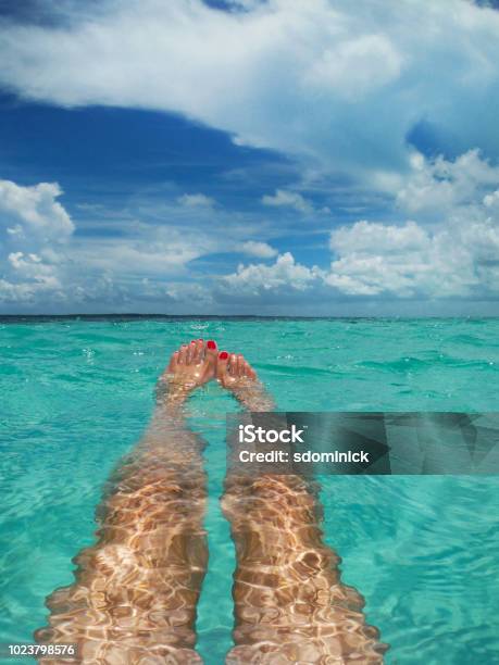 Floating In Clear Blue Ocean Stock Photo - Download Image Now - Personal Perspective, Sea, Adult