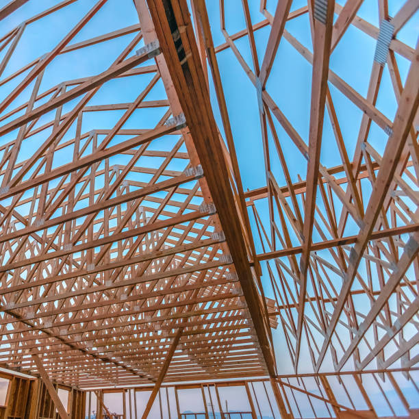 istock Looking up at new wood beams building wide angle 1023807166