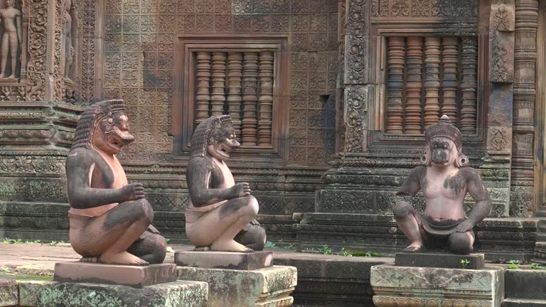 close up of hindu diety statues at banteay srei temple in angkor