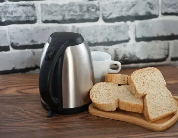 electric  kettle and  bread prepare breakfast