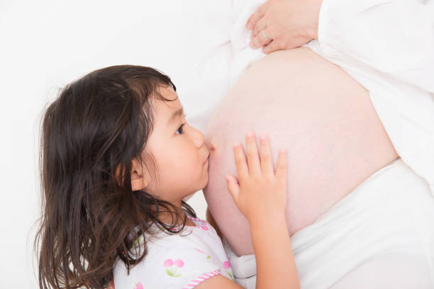 istock Mother and daughter on white background 1023834832