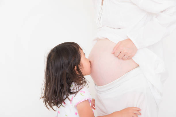 istock Mother and daughter on white background 1023834980