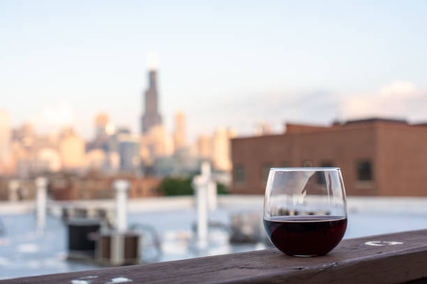istock Wine glasses on a rooftop in the city 1023845728