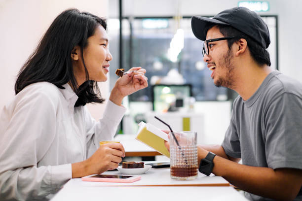 istock asian couple having fun together at a coffee shop 1023848242