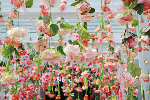 istock Wedding ceremony decoration with many artificial flower hanging from ceiling. Beautiful Upside down roses. 1023855392
