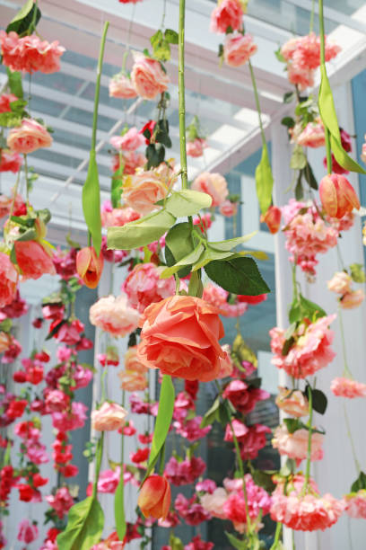 istock Wedding ceremony decoration with many artificial flower hanging from ceiling. 1023857820