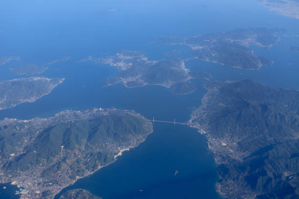 istock an Aerial view of plane window looking down to land 1023873128