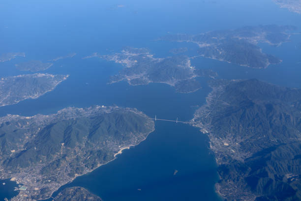 istock an Aerial view of plane window looking down to land 1023873148