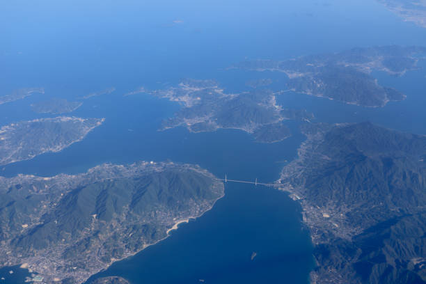 istock an Aerial view of plane window looking down to land 1023873152